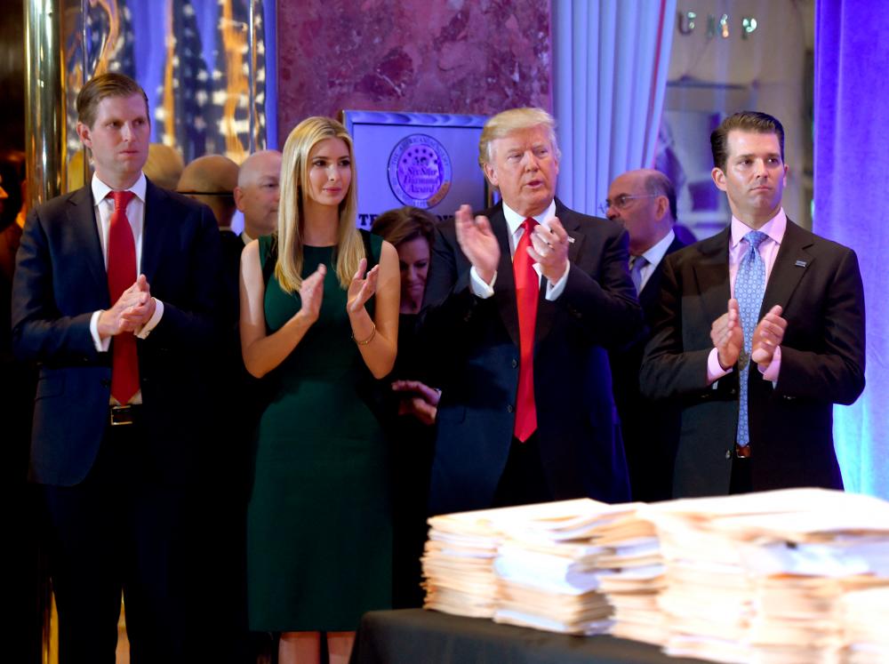 (FILES) In this file photo taken on January 11, 2017, US President-elect Donald Trump along with his children Eric (L), Ivanka and Donald Jr., arrive for a press conference January 11, 2017 at Trump Tower in New York. AFPPIX