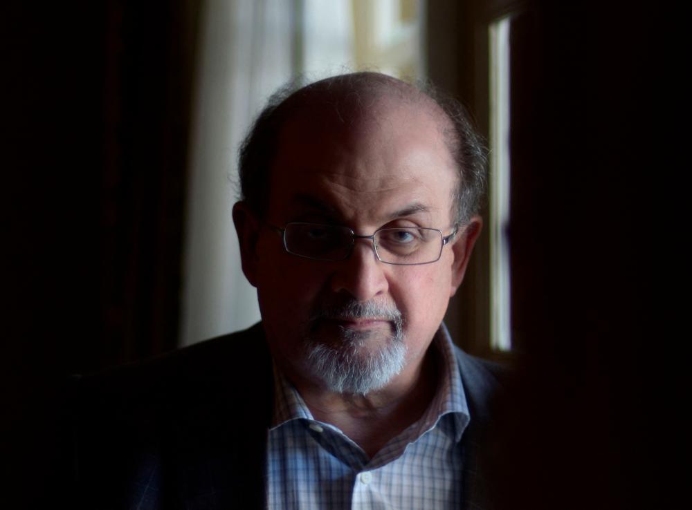 In this file photo taken on April 19, 2013, British author Salman Rushdie, poses for a portrait during ‘Midnight’s Children’ press day on April 19, 2013 in Los Angeles, California. AFPPIX