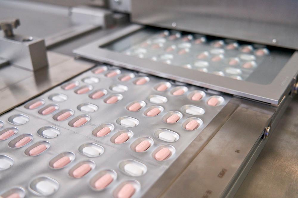 (FILES) This handout file photo provided on November 16, 2021, courtesy of Pfizer shows the making of its experimental Covid-19 antiviral pills, Paxlovid, in Freiburg, Germany. AFPPIX