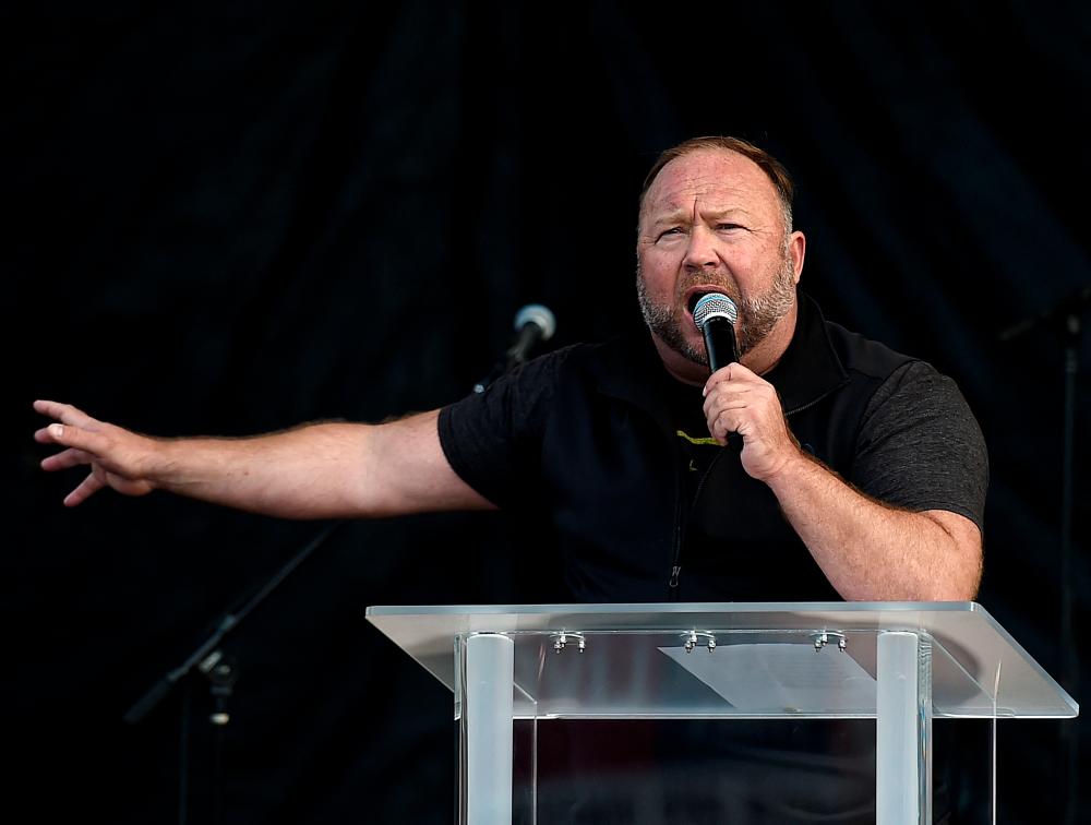 In this file photo taken on December 12, 2020 US far-right radio show Alex Jones speaks to supporters of US President Donald Trump as they demonstrate in Washington, DC, to protest the 2020 election/AFPPix