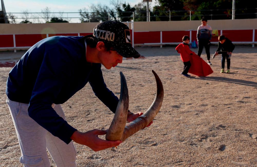 Young students train at a bullfighting school in Arles, southern France, on November 23, 2022. - AFPPIX