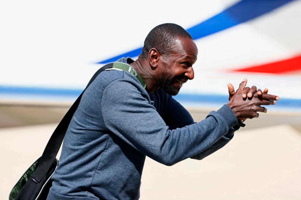 French hostage journalist Olivier Dubois, who was held hostage in Mali for nearly two years by the Support Group for Islam and Muslims (GSIM), reacts as he arrives at the Villacoublay airport, in Velizy-Villacoublay, near Paris, on March 21, 2023. AFPPIX