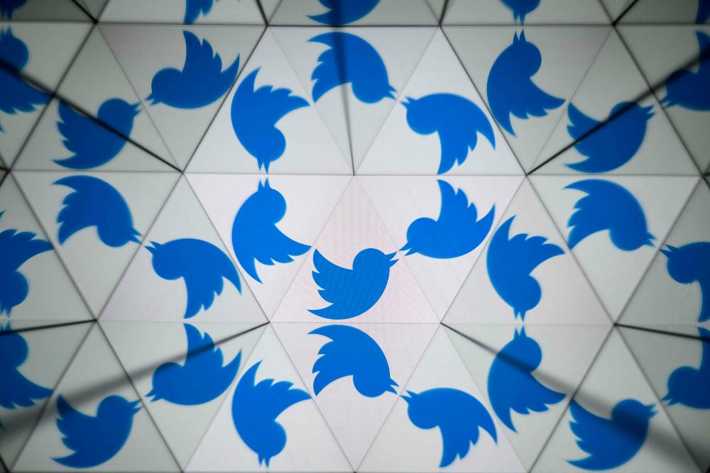 The twitter’s logo is pictured on screen reflected by mirrors in Mulhouse, eastern France on May 30, 2023/AFPPix
