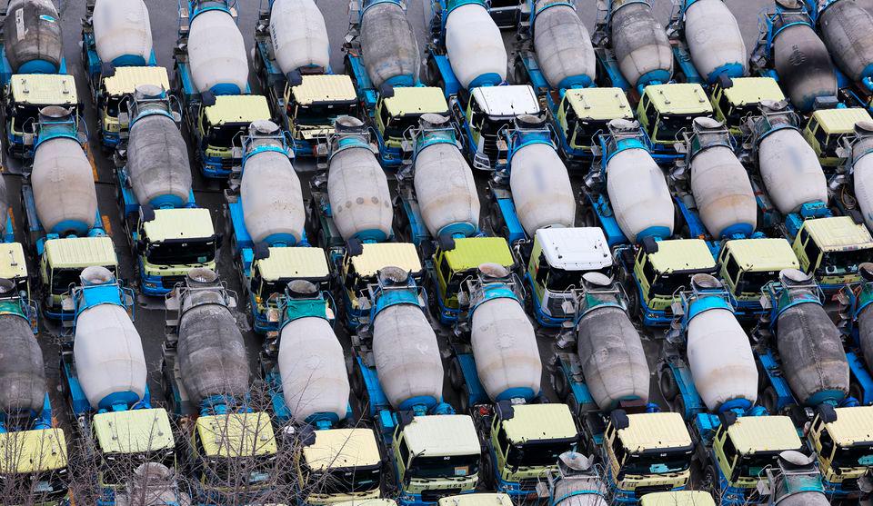Concrete mixer trucks are parked at a factory due to a strike by a truckers’ union in Anyang, South Korea November 28, 2022. REUTERSPIX