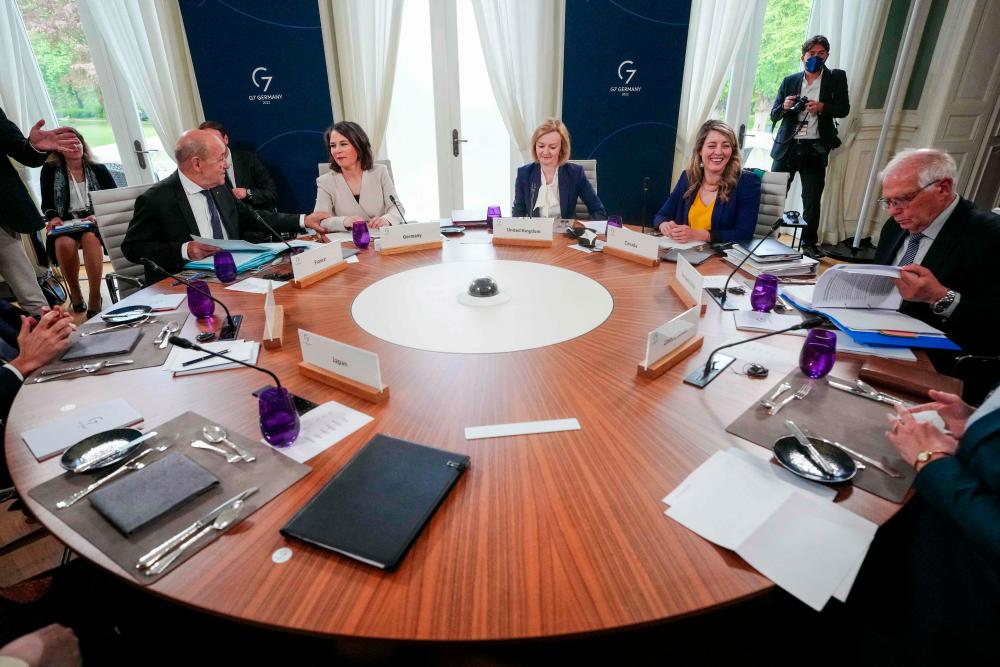 (L-R) French Foreign Minister Jean-Yves Le Drian, German Foreign Minister Annalena Baerbock, British Secretary for Foreign Affairs Elizabeth Truss, Canadian Foreign Minister Melanie Joly and the High Representative of the European Union for Foreign Affairs and Security Policy Josep Borrell sit around a table prior to a meeting on the second day of the G7 Foreign Ministers meeting in Wangels, northern Germany, on May 13, 2022. AFPpix