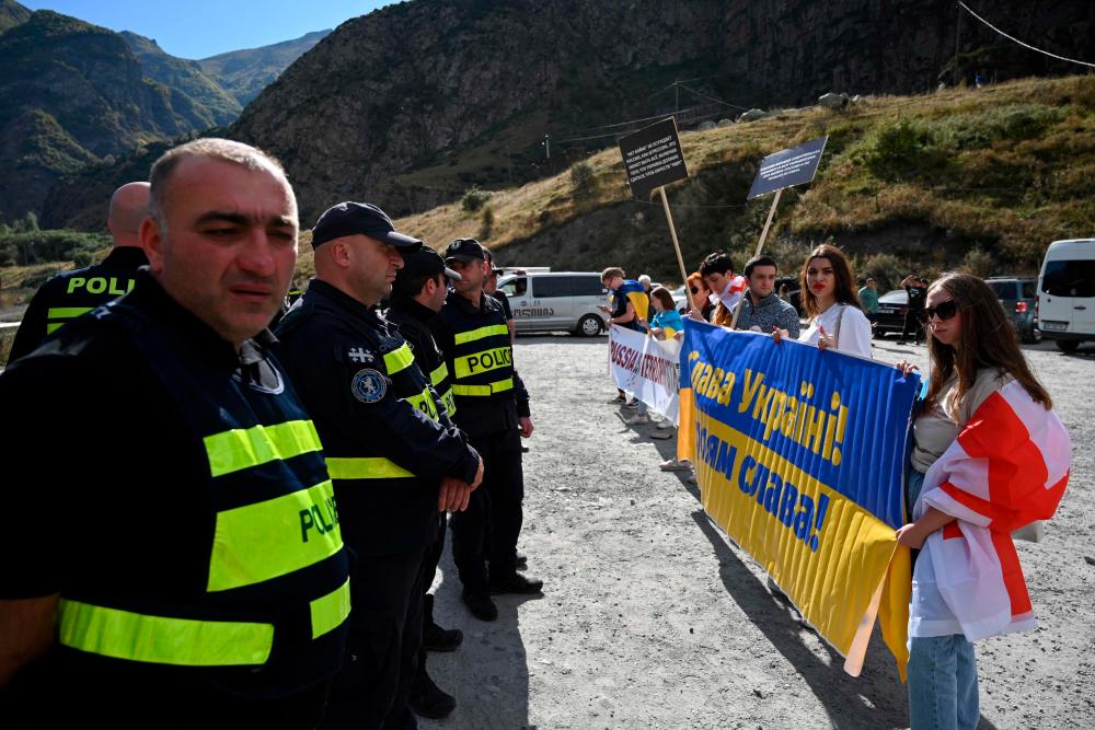 Georgian activists protest against mass immigration from Russia at the Kazbegi / Verkhniy Lars border crossing point between the two countries on September 28, 2022. AFPPIX