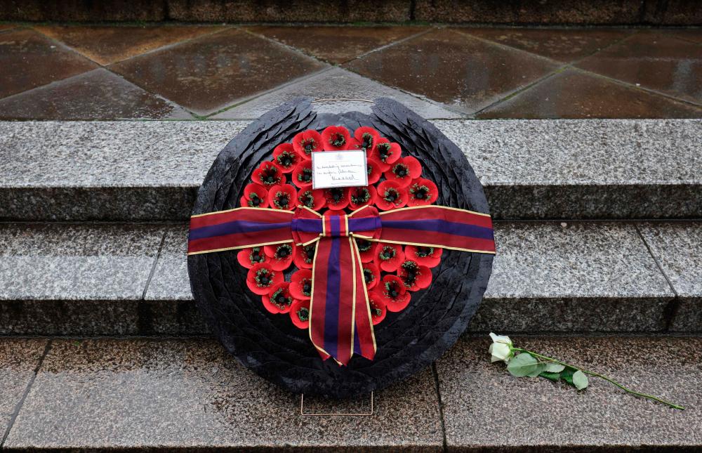 The lettering ‘In everlasting remembrance’ is seen written on a card on the wreath placed by Britain’s King Charles III outside the St Nikolai Memorial Church after a wreath-laying ceremony in Hamburg, northern Germany on March 31, 2023/AFPPix