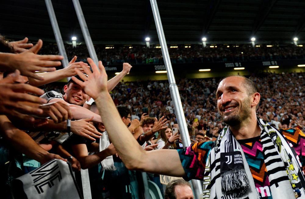 Juventus' Giorgio Chiellini with fans after playing his last home match for Juventus REUTERSpix