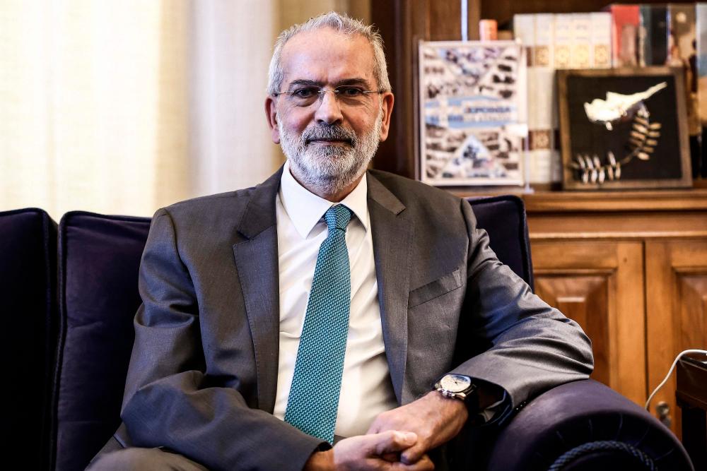 Ioannis Sarmas, the head of the Court of Audit that monitors public finances, was sworn in to head a caretaker government tasked with calling the next election. AFPPIX
