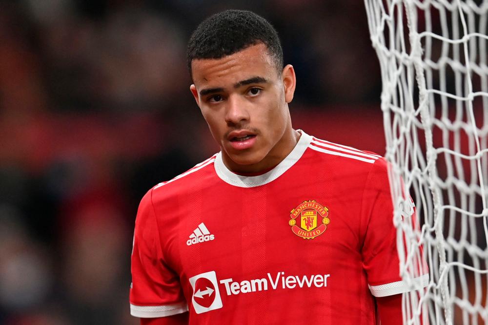 In this file photo taken on January 03, 2022 Manchester United's English striker Mason Greenwood is substituted during the English Premier League football match between Manchester United and Wolverhampton Wanderers at Old Trafford in Manchester, north west England. AFPpix