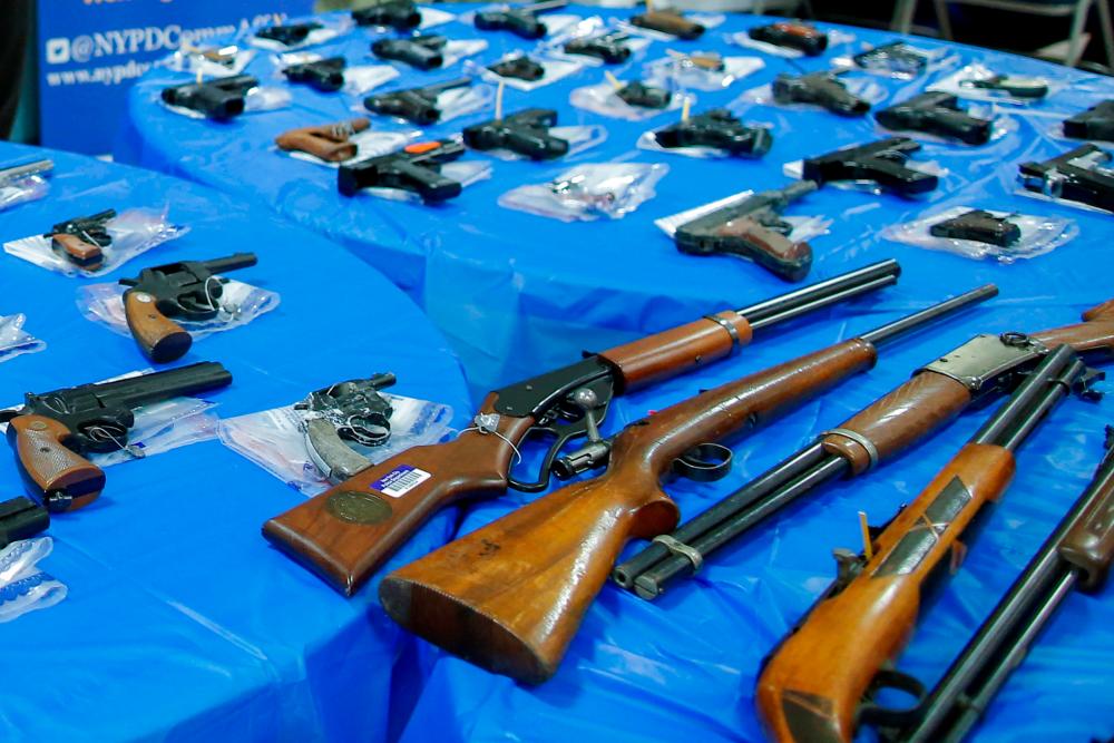 File photo: Guns are displayed after a gun buyback event organized by the New York City Police Department (NYPD), in the Queens borough of New York City, U.S., June 12, 2021. REUTERSpix