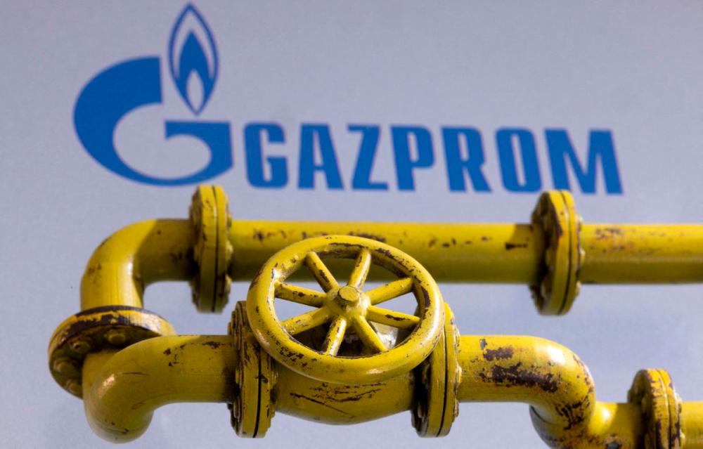 3D printed Natural Gas Pipes are placed on displayed Gazprom logo in this illustration taken, January 31, 2022. REUTERSPIX