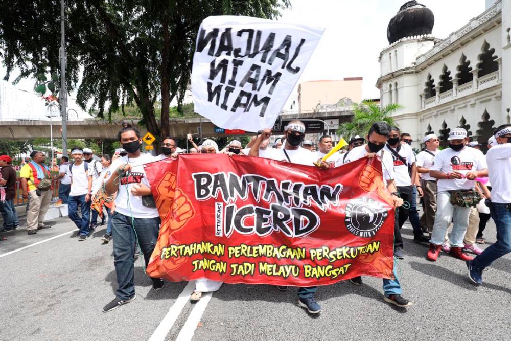 Participants march at Dataran Merdeka.