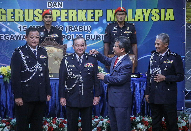 Inspector-General of Police Datuk Seri Abdul Hamid Bador (L) during the handing over of duties to newly appointed Deputy IGP Datuk Mazlan Mansor (2nd L), on May 15, 2019. — Sunpix by Amirul Syafiq Mohd Din