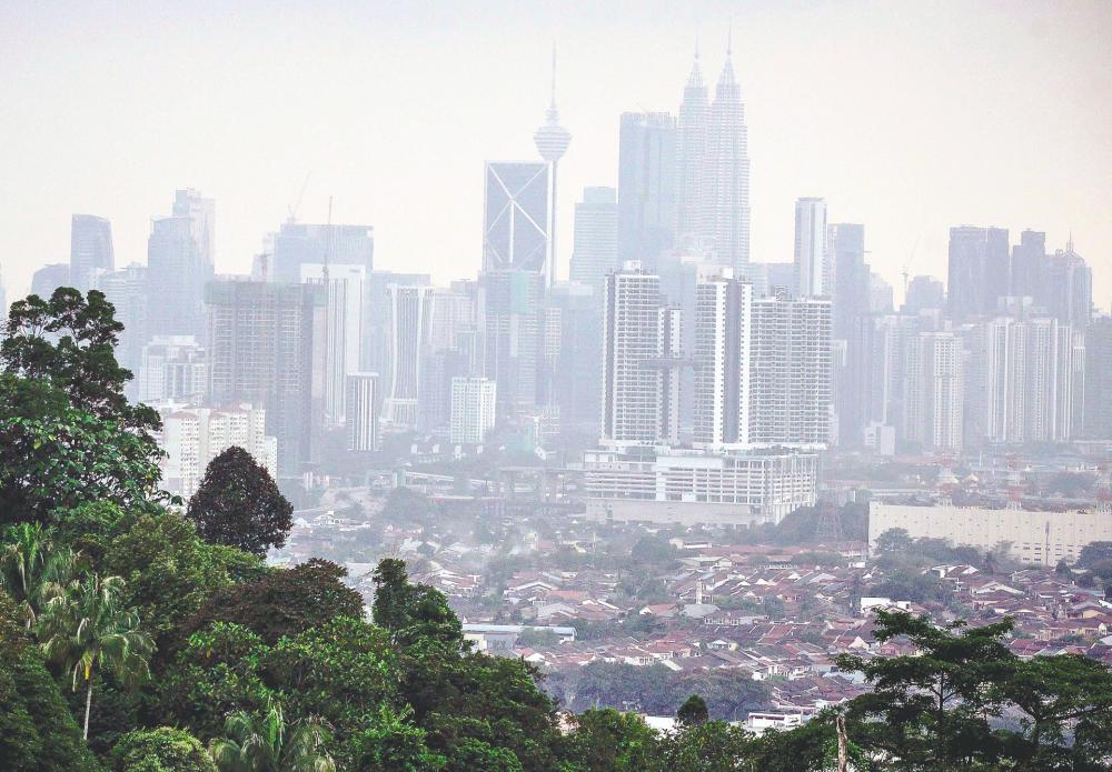 A blurry scene of the city as seen from Taman Ukay Perdana in Kuala Lumpur. – ADIB RAWI YAHYA/THESUN