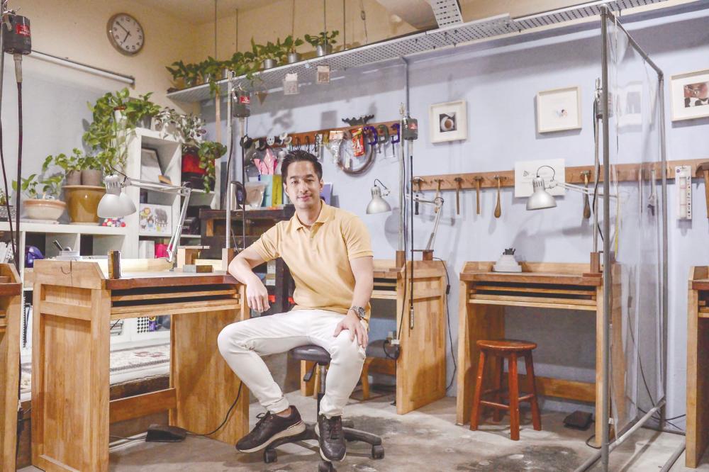 Tan in his studio surrounded by his work tools. – Adib Rawi/theSun