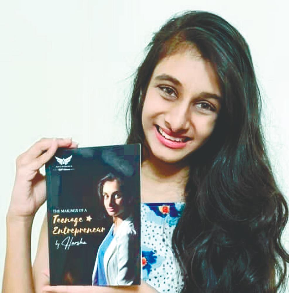 Harsha Ravindran with her book. – FB pix