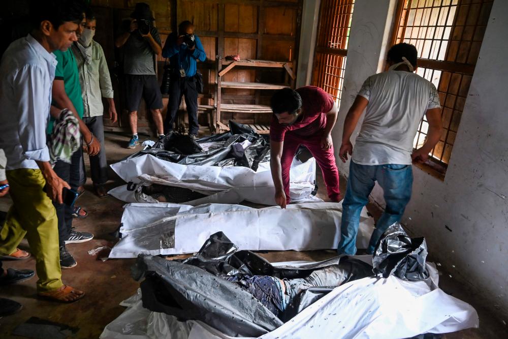 Bodies are seen at a high school used as temporary mortuary to identify the dead recovered from the carriage wreckage of a three-train collision near Balasore, in India’s eastern state of Odisha, on June 4, 2023/AFPPix