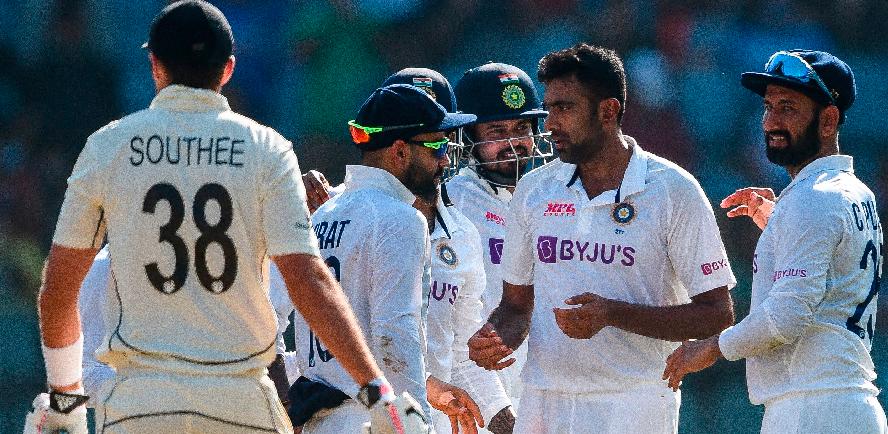 India’s Ravichandran Ashwin (2nd right) celebrates after the dismissal of New Zealand’s Tim Southee (left) during the second day of the second Test cricket match at the Wankhede Stadium in Mumbai. – AFPPIX