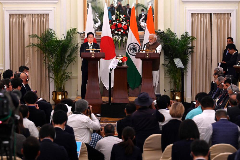 Japan’s Prime Minister Fumio Kishida (center L) and his Indian counterpart Narendra Modi (center R) attend a joint media briefing at the Hyderabad House in New Delhi on March 20, 2023. AFPPIX