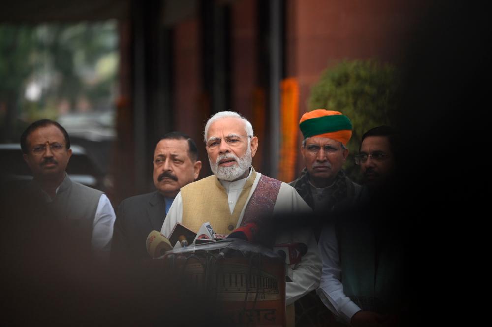 India’s Prime Minister Narendra Modi (C) speaks to media at the opening of the budget session of Parliament in New Delhi on January 31, 2023. AFPPIX