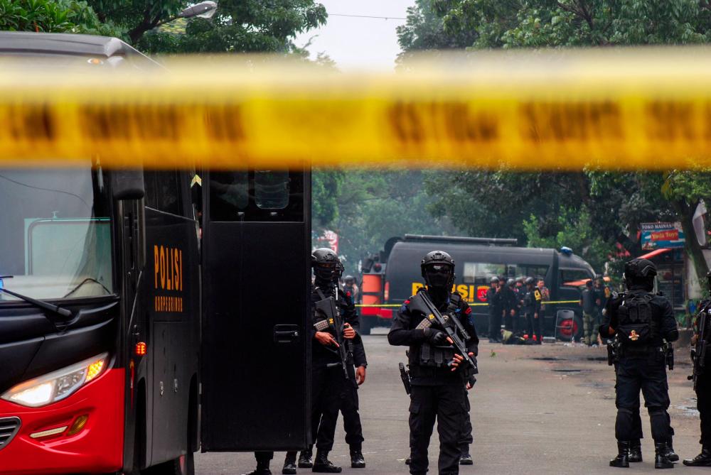 Police secure the site of a suicide bombing outside a police station at Astanaanyar in Bandung, West Java province, on December 7, 2022. - AFPPIX