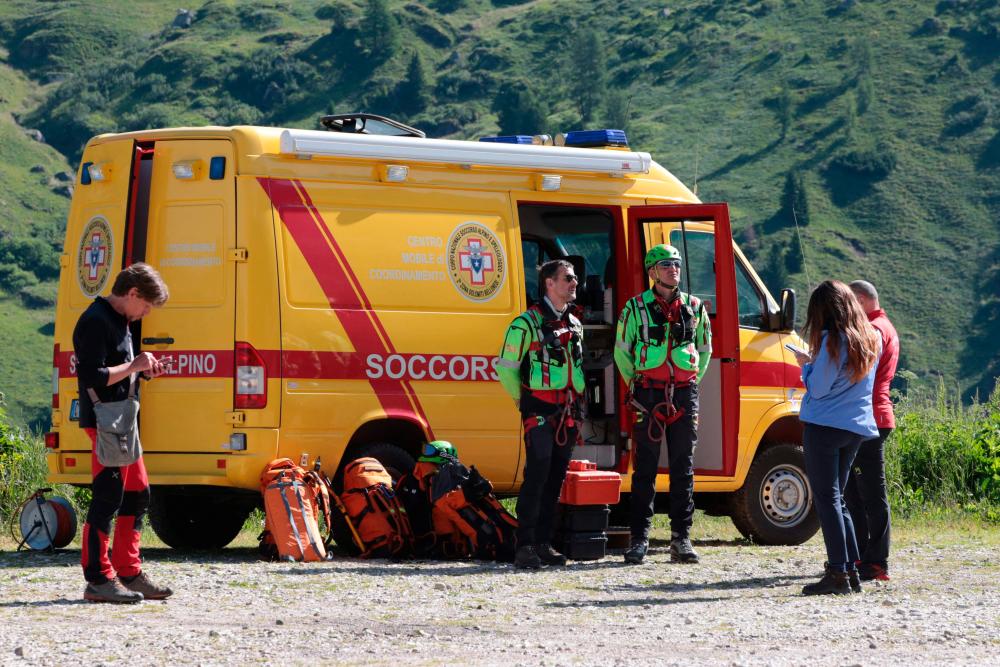 Rescuers get ready for search operations on July 4, 2022 after the glacier on the mountain of Marmolada, the highest in the Dolomites, collapsed the day before, one day after a record-high temperature of 10 degrees Celsius (50 degrees Fahrenheit) was recorded at the glacier’s summit. AFPPIX