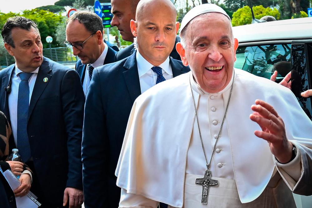 Pope Francis addresses the media as he leaves the Gemelli hospital on April 1, 2023 in Rome, after being discharged following treatment for bronchitis/AFPPix