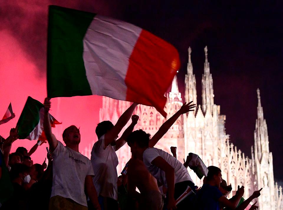 Soccer Football - Euro 2020 - Final - Fans gather for Italy v England - Milan, Italy - July 11, 2021. Italy fans celebrate after winning the Euro 2020 at Piazza Duomo. REUTERSpix