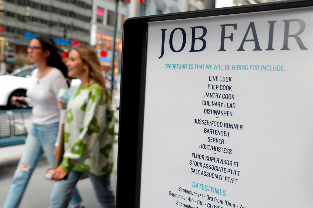 Signage for a job fair is seen in Manhattan, New York City. REUTERSpix