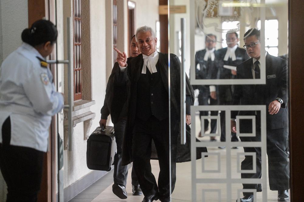 Attorney-General Tommy Thomas and the prosecution team arrive at the Jalan Duta Court Complex in Kuala Lumpur on April 3, 2019. — Bernama
