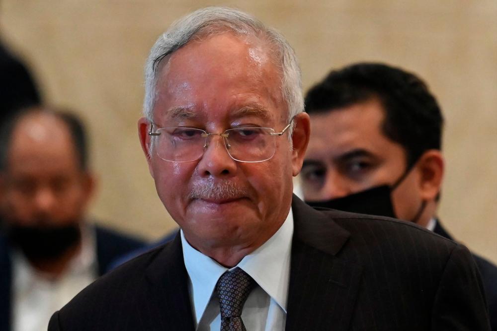 Malaysia's former prime minister Najib Razak reacts during a press conference at the federal court in Putrajaya on August 18, 2022. Malaysia's top court on August 18 began hearing ex-leader Najib Razak's appeal to overturn his jail sentence for corruption in a high-stakes legal gambit that can see him either locked up or launch a political comeback. AFPPIX