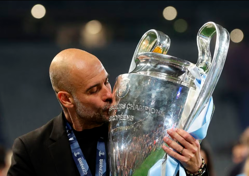 Champions League Final - Manchester City v Inter Milan - Ataturk Olympic Stadium, Istanbul, Turkey - June 11, 2023 Manchester City manager Pep Guardiola kisses the trophy as he celebrates winning the Champions League. REUTERSPIX
