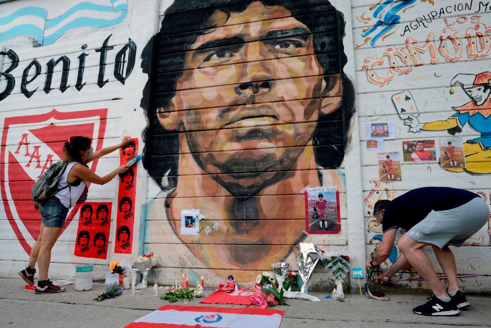 People gather to mourn the death of football legend Diego Maradona, outside the Diego Amrando Maradona stadium, in Buenos Aires November 25, 2020. — Reuters
