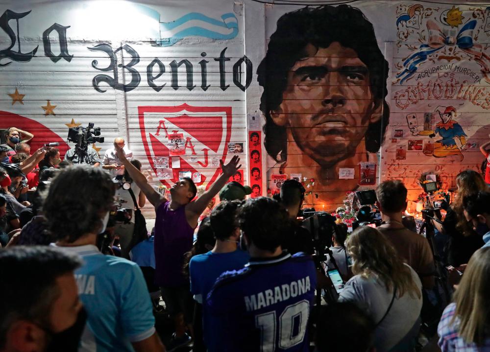 View of an improvised altar set up by Fans of Argentinos Juniors' football team, where football legend Diego Maradona used to play. – AFPPIX