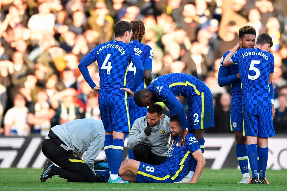 Chelsea's Croatian midfielder Mateo Kovacic receives medical attention during the English Premier League football match between Leeds United and Chelsea at Elland Road in Leeds, northern England on May 11, 2022. AFPpix