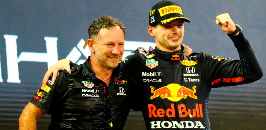 Red Bull’s Max Verstappen (right) celebrates winning the race and the world championship with team principal Christian Horner on the podium. – REUTERSPIX