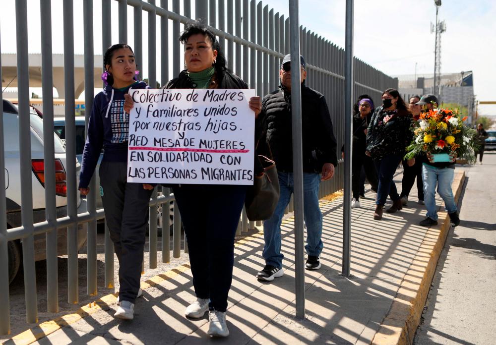 A group of activists support migrants during a protest outside an immigration detention center in Ciudad Juarez, Chihuahua state, Mexico, on March 28, 2023/AFPPix