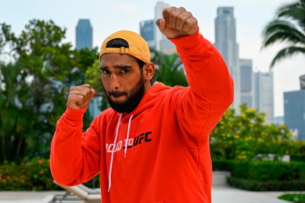 Indian mixed martial arts fighter Anshul “King of Lions” Jubli poses for a photograph ahead of an Ultimate Fighting Championship (UFC) tournament in Singapore on June 8, 2022. AFPPIX