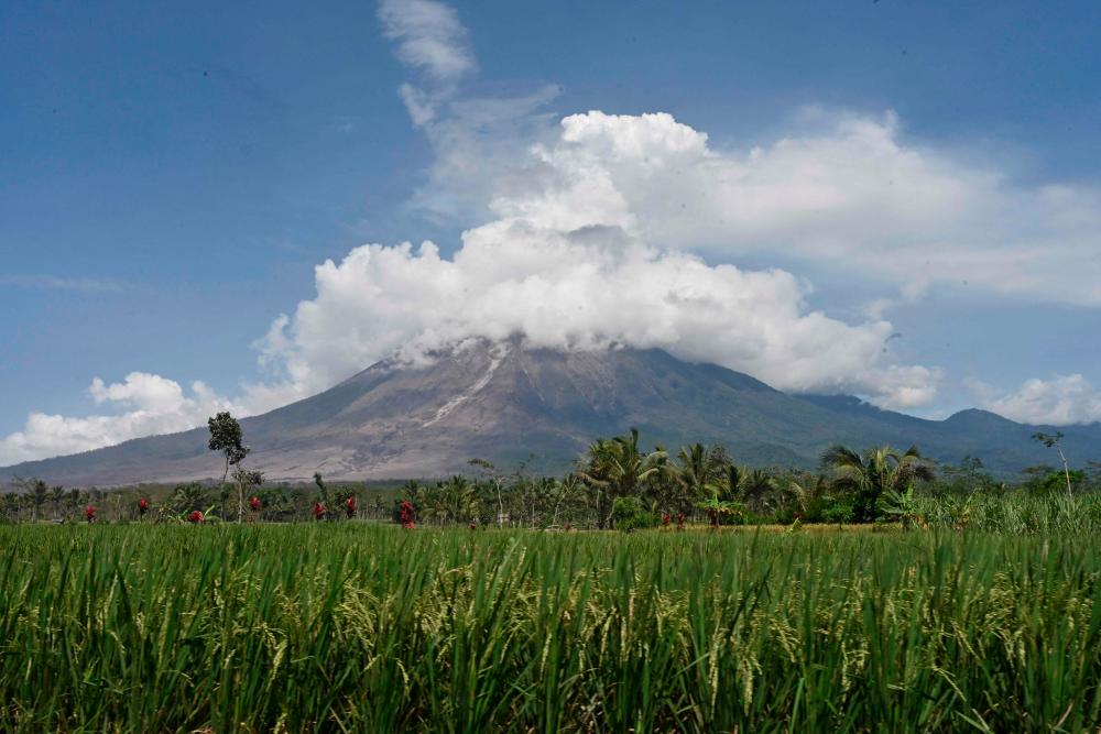 Mount Semeru is seen at the Curah Kobokan village in Lumajang on December 7, 2021, following the volcano's eruption that killed at least 22 people. AFPpix