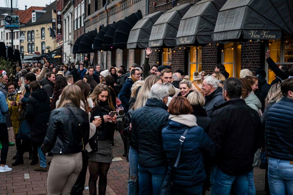 Thousands of people take part in “the Tour Du Roer”, an alternative pub crawl organised by 20 cafes and other catering establishments as a protest against the Dutch government’s Covid-19 measures, in Roermond on January 23, 2022. AFPPIX