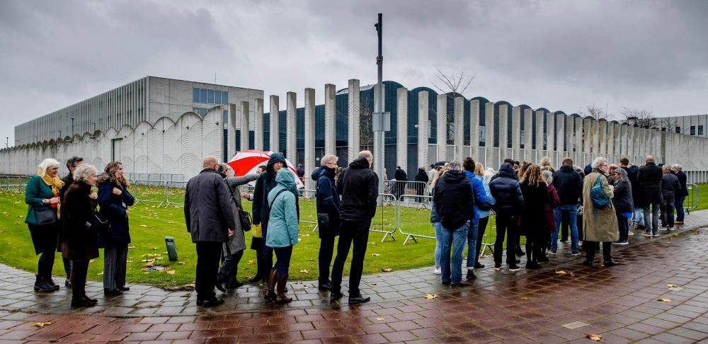 Relatives of the victims of the the downing of the MH17 flight arrive at the Schiphol Judicial Complex in Badhoevedorp on November 17, 2022, prior to the verdict in the trial in which four men are prosecuted for their involvement in the case/AFPPix