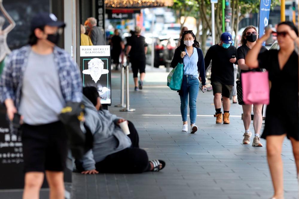 Shoppers walk through a retail district in the wake of coronavirus disease (Covid-19) lockdown restrictions being eased in Auckland, New Zealand, November 10, 2021. REUTERSpix