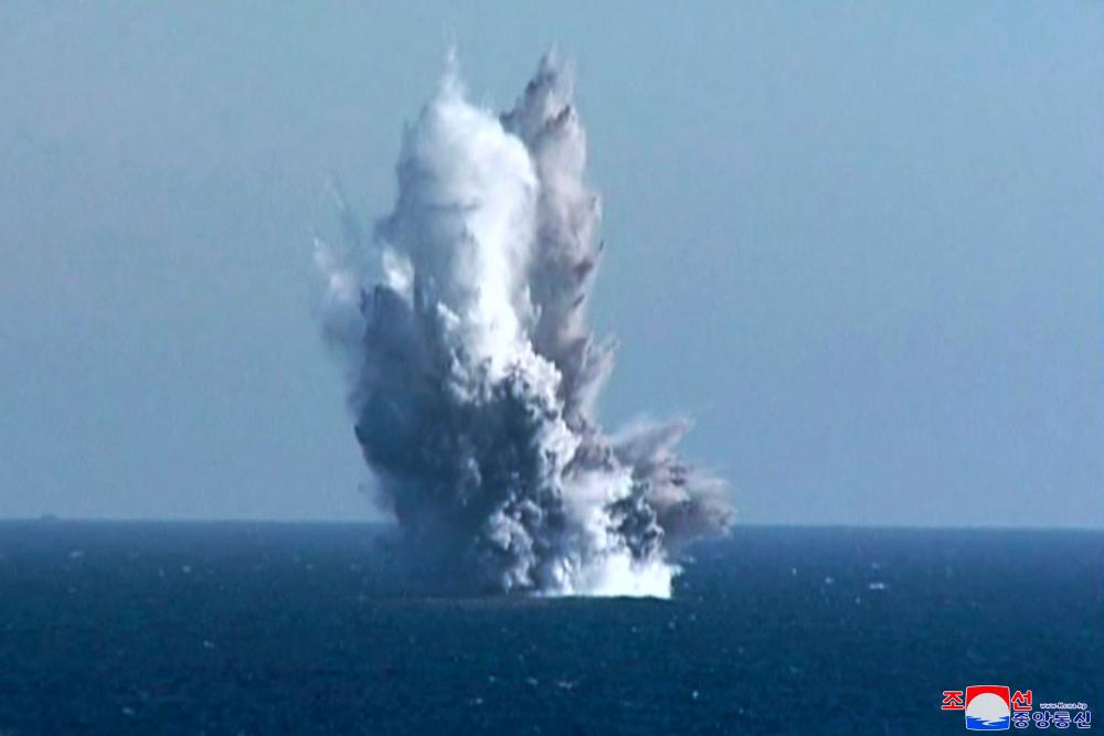 This picture taken on March 23, 2023 and released by North Korea’s official Korean Central News Agency (KCNA) on March 24, 2023 shows the underwater nuclear strategic attack weapon system “Haeil” firing in the water off the coast of Riwon County of South Hamgyong Province, East Korea Bay/AFPPix