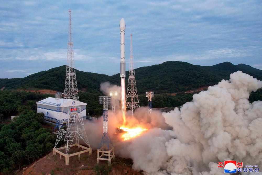 This picture taken on May 31, 2023 and released from North Korea’s official Korean Central News Agency (KCNA) on June 1, 2023 shows a new satellite-carrying rocket as it leaves the launch pad, at an undisclosed location in North Korea. AFPPIX
