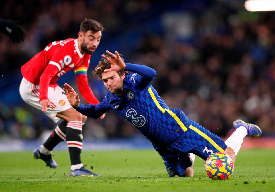 Soccer Football - Premier League - Chelsea v Manchester United - Stamford Bridge, London, Britain - November 28, 2021 Manchester United’s Bruno Fernandes in action with Chelsea’s Marcos Alonso. REUTERSPix