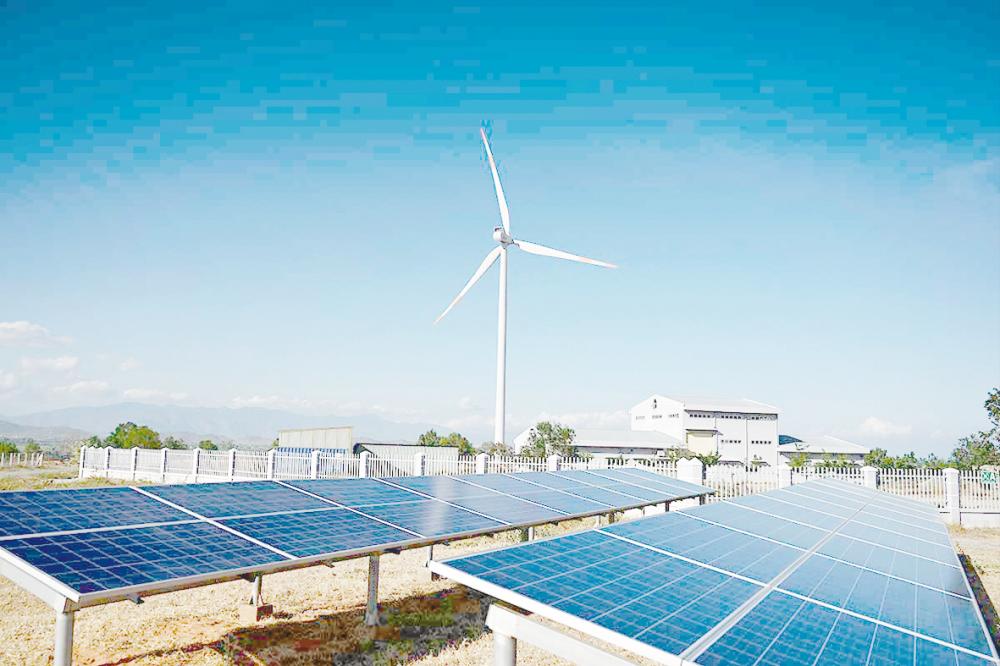 Solar panel installations and a wind turbine at a wind farm in southern Vietnam’s Binh Thuan province. Asia is expected to be the main driver of renewable capacity increase this year, AmInvestment Bank Research said. – AFPPIX