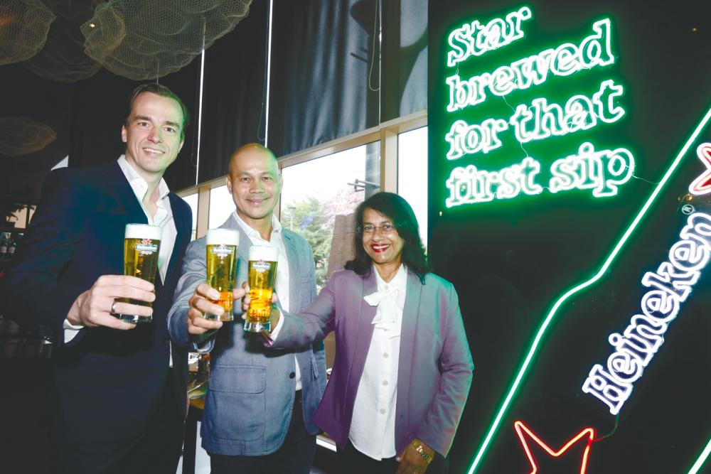 From left: Folkerts, Roland and Heineken corporate affairs and legal director Renuka Indrarajah.