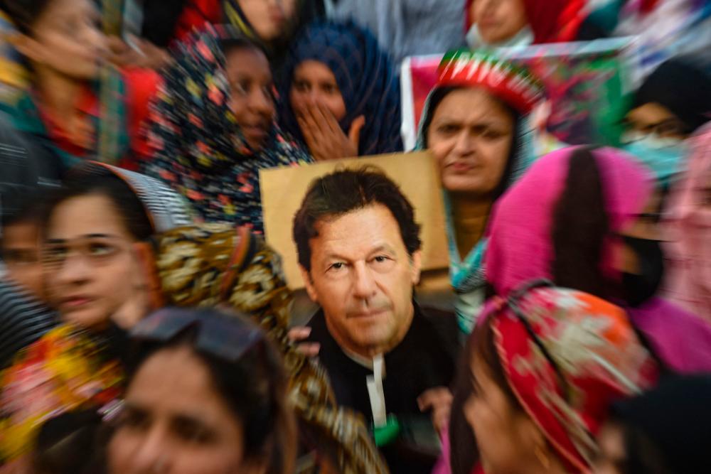 Supporters of Pakistan’s former prime minister Imran Khan, gather during a protest in Karachi on March 19, 2023, demanding release of arrested party workers in recent police clashes. AFPPIX
