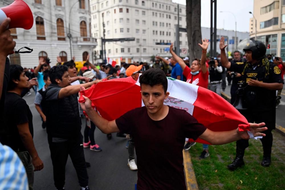 People take part in a demonstration demanding the release of ex-President Pedro Castillo, in Lima, on December 8, 2022, a day after his impeachment. AFPPIX